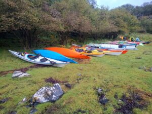 Kayaks landed on beach near hostel